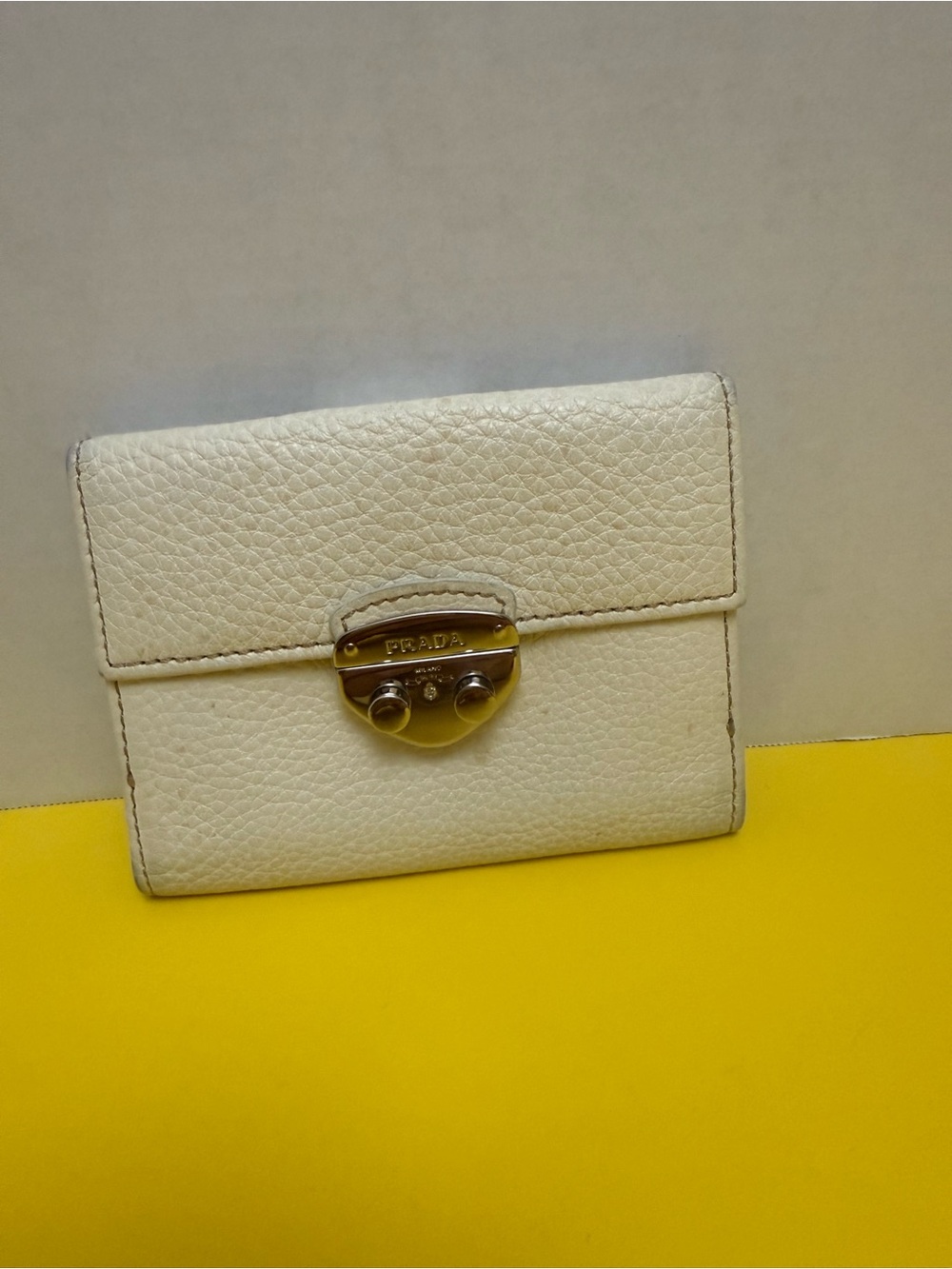 Prada Cream Pebbled Leather Small Wallet with Gold Tone Lock